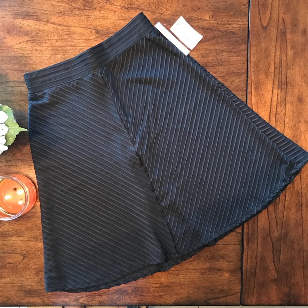 NEW : Black Skirt Slightly above the knee.